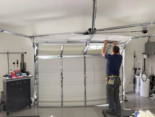 Longmont Garage Door Repair specialist performing precise section replacement on Longmont garage door