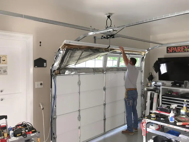 Garage door section replacement by Longmont Garage Door Repair in Longmont