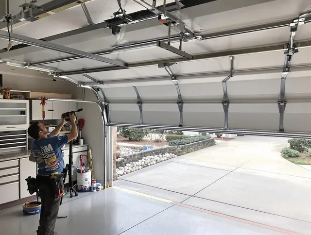 Garage door track repair service by Longmont Garage Door Repair in Longmont